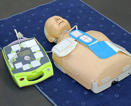 Automated External Defibrillator with training dummy mannequin